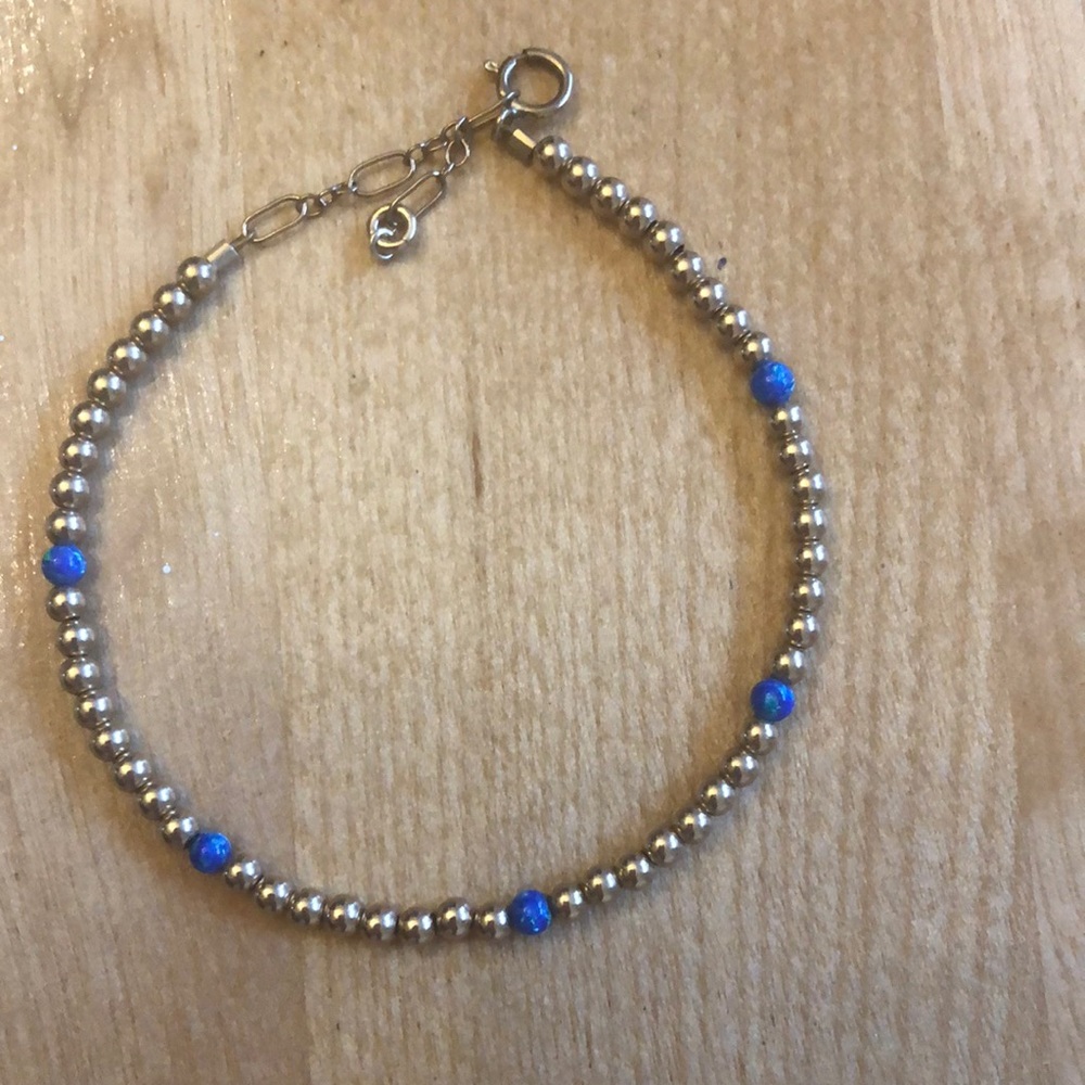 Gold tone beaded gold filled bracelet with blue opal like beads